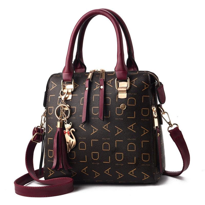 Bolsa Feminina em Couro Le Charme Félin™ + Chaveiro Glamour de Brinde